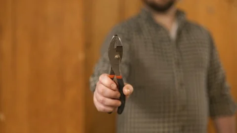 Man showing work tools Stock Footage 120998343