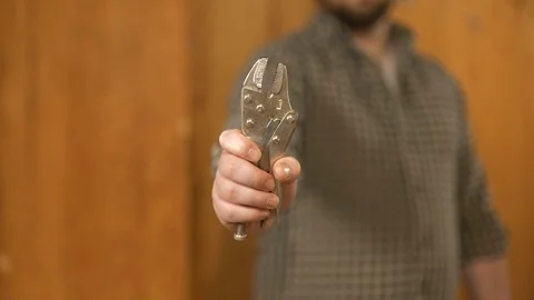 Man showing work tools Stock Footage 120998472