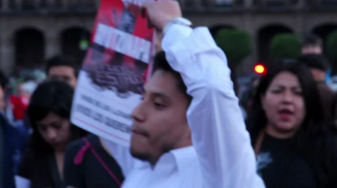 Man shows a banner in a march protest for the students disappeared in Guerrero Stock Footage 44215150