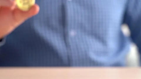 Man Shows Bitcoin In His Hand. Bitcoin Price Rise and Fall Concept Vidéo 148867176