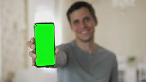 Man shows blank screen cell phone Stock Footage 155989742