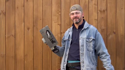 A man shows a chainsaw 4K Stock Footage 291263671