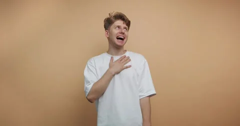Man shows different emotions in four frames against a plain background Stock Footage 328247064