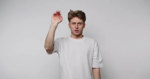 Man shows different hand signals for communication in a studio setting Vídeos de archivo 328248438