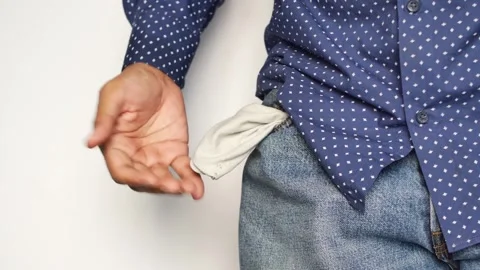 Man shows empty pockets, indicating financial problem or lack of money, clo.. Stock Footage 332747233