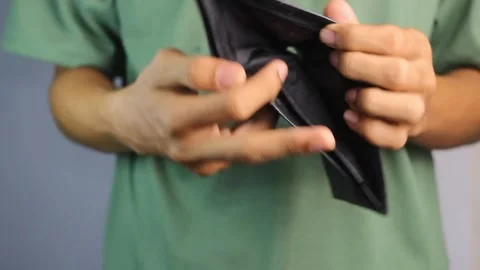A man shows an empty wallet. Stock Footage 306141024