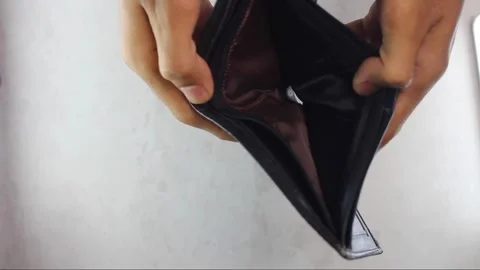 A man shows an empty wallet. Stock Footage 306263339