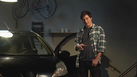 A man shows off his car Stock Footage 128179057