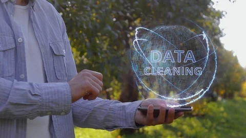Man shows hologram with text Data cleaning Stock Footage 104673194