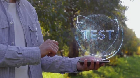 Man shows hologram with text Test Stock Footage 107569904