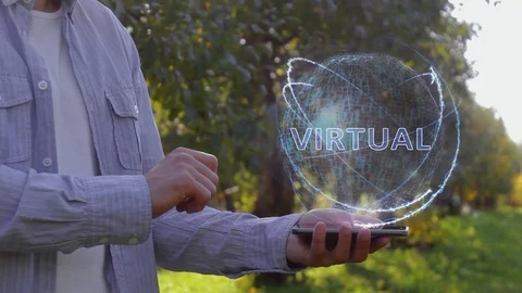 Man shows hologram with text Virtual Stock-Footage 107656879