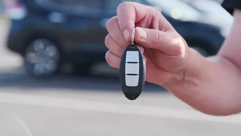 A man shows the keys to his new car purchased from a car dealer Stock Footage 112026353