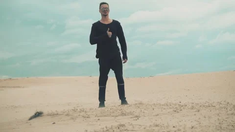 Man shows the likes in the desert Stock Footage 89779651