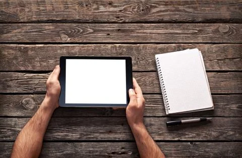 Man shows screen of digital tablet in his hands Stock Photos