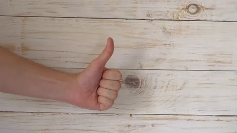 The man shows the sign "like" Video stock 77728122