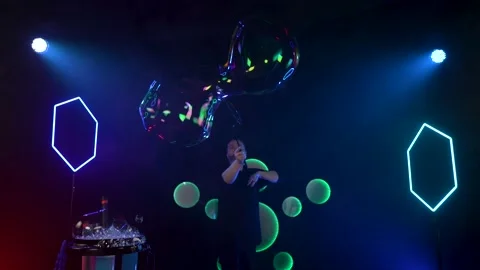 Man shows a soap bubble show in the Studio Stock Footage 141744421