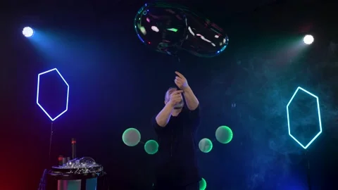 Man shows a soap bubble show in the Studio Video stock 141744446