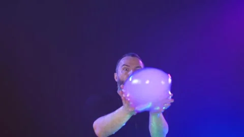 Man shows a soap bubble show in the Studio Stock Footage 141744759