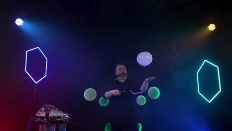 Man shows a soap bubble show in the Studio Stock Footage 141745175