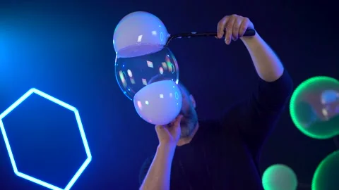 Man shows a soap bubble show in the Studio Stock Footage 141745188