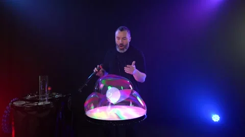 Man shows a soap bubble show in the Studio Stock Footage 142055690