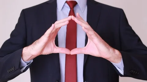 Man shows something round with his hands 動画素材 94137834