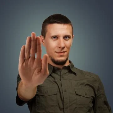 Man shows stop gesture. Stock Photos