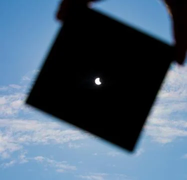 Man shows sun eclipse Stock Photos