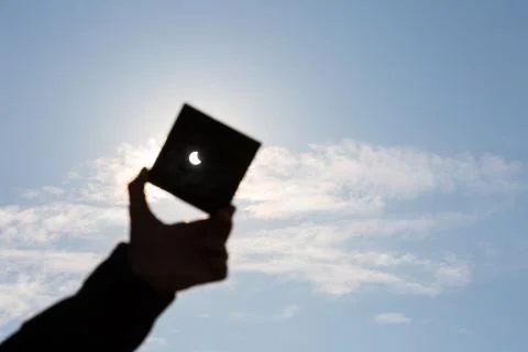 Man shows sun eclipse Stock Photos