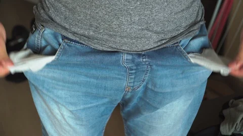 Man shows turns empty pockets bankrupt no money Financial crisis due coronavirus Video stock 127394749