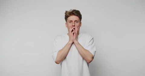 Man shows various surprised expressions on face in four close-up frames in .. Stock Footage 317327765