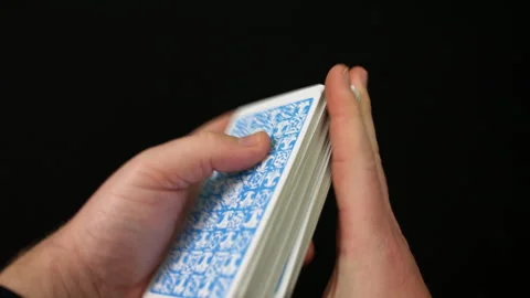 A man shuffling a tarot card deck Stock Footage 296626570