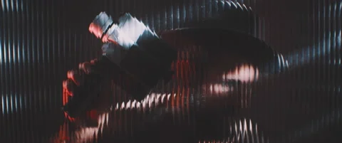 Man in shutter lights looking through clear panel with vintage camera Stock Footage 203572250