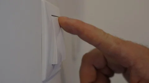 Man Shutting Off the Light in the Office from the Switch on the Wall Stock-Footage 122667603