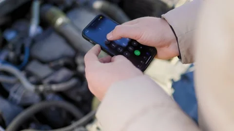A man on the side of the road, using his mobile Stock Footage 234691987
