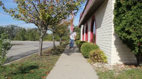 Man on a sidewalk Stock Footage 8916151