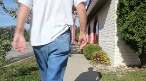 Man on a sidewalk Stock Footage 8916209