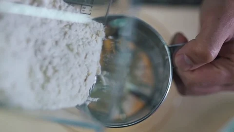 Man sifts flour close up Stock Footage 79109156