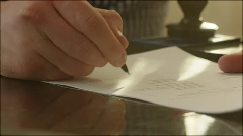 Man Signing a Contract and Setting a Stamp Stock Footage 60355711