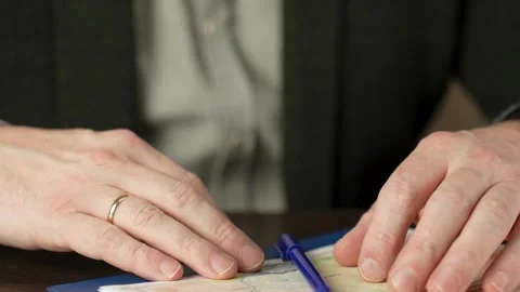 Man signing divorce document and taking off ring Video stock 264762778