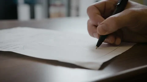 Man Signing A Document Or A Contract On A White Paper. Video stock 162403596