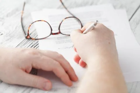 Man is signing a document Foto stock