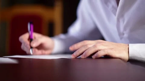 A man is signing document - side view Stock Footage 58395384