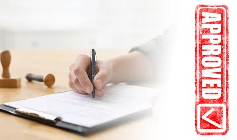 Man signing document at table and red stamp Approved, banner design 스톡 사진