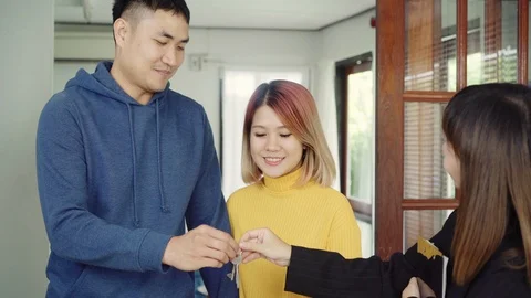 Man signing some documents and handshaking with broker while sitting at desk. Stock Footage 97060713