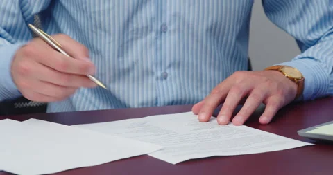 The man signs a contract Video stock 159538624