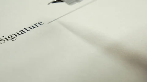 A man signs a document with an ink pen. Stock-Footage 130567447