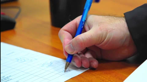 A man signs documents close-up Stock Footage 169383371