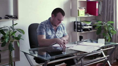 Man signs documents at the table Stock Footage 59619942