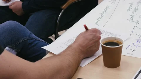 A man signs an important document about the development of his company Stock Footage 155458308